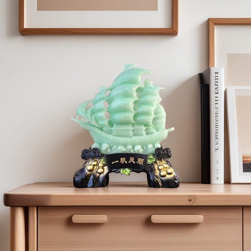 A green jade-colored sailboat ornament sculpture for home decoration