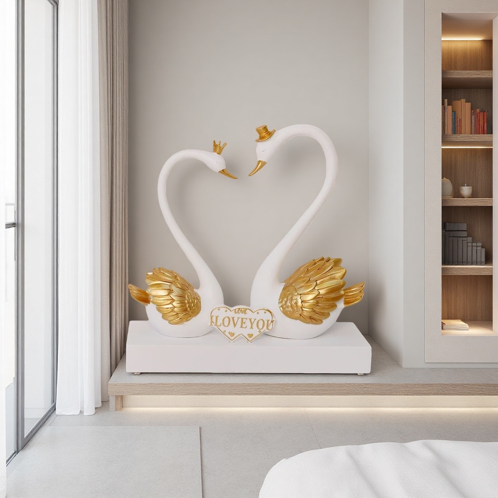 Couple swan ornaments: A pair of white swans with golden wings decorating the neck. Heart-shaped base engraved with "LOVE YOU" Specification image