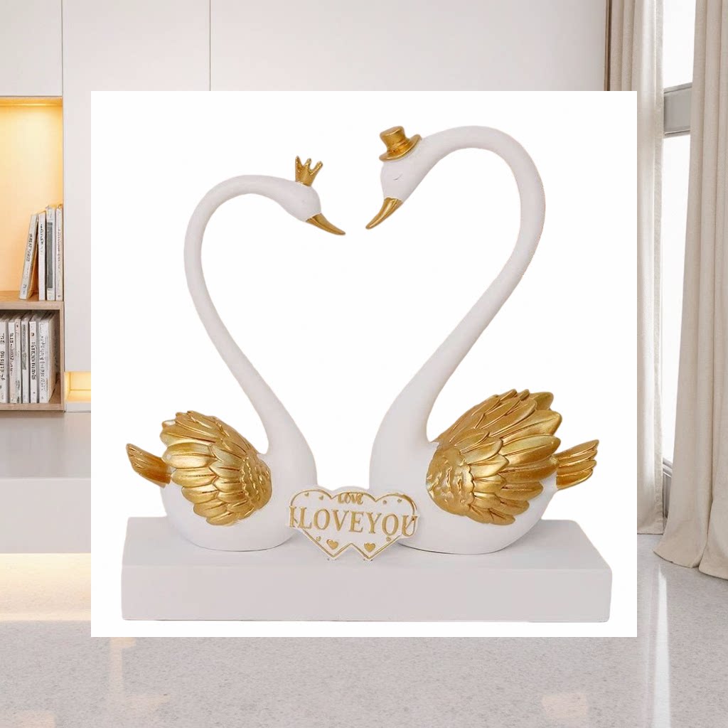 Couple swan ornaments: A pair of white swans with golden wings decorating the neck. Heart-shaped base engraved with "LOVE YOU"