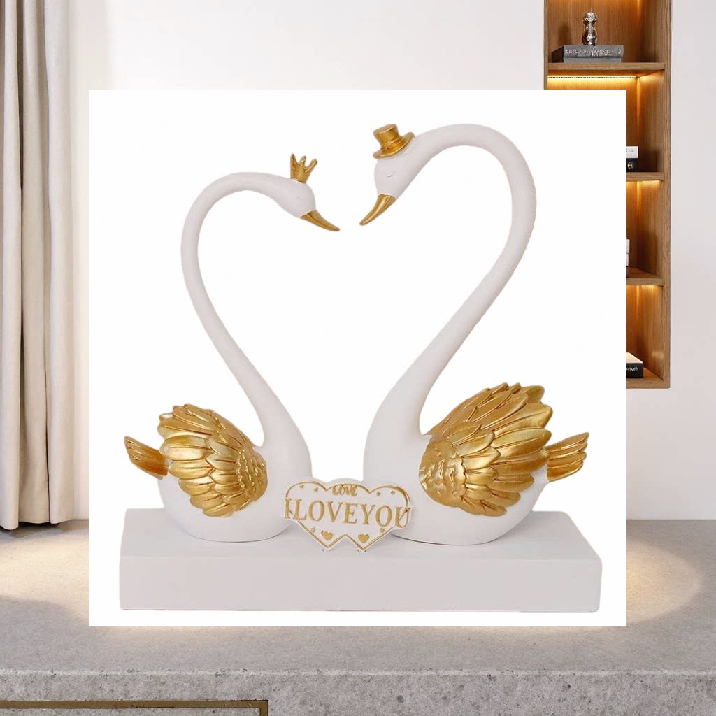 Couple swan ornaments: A pair of white swans with golden wings decorating the neck. Heart-shaped base engraved with "LOVE YOU" details Picture