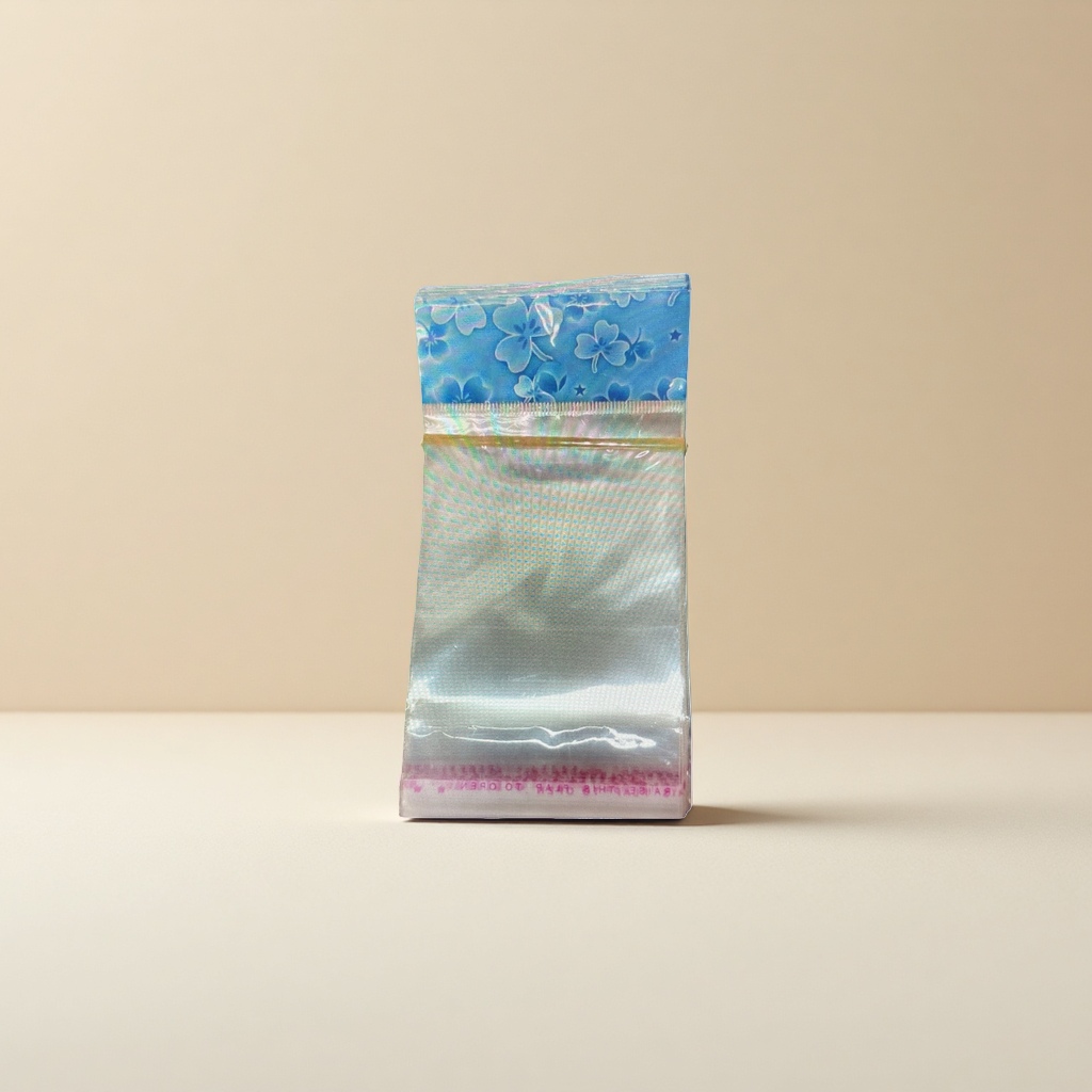 A transparent plastic bag with blue floral patterns