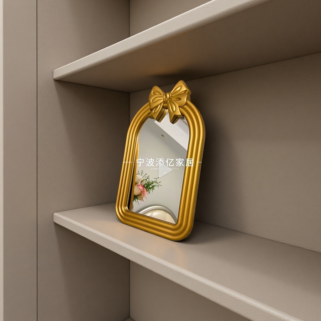 The golden bow decorative mirror frame is a fashionable home decoration with a simple style