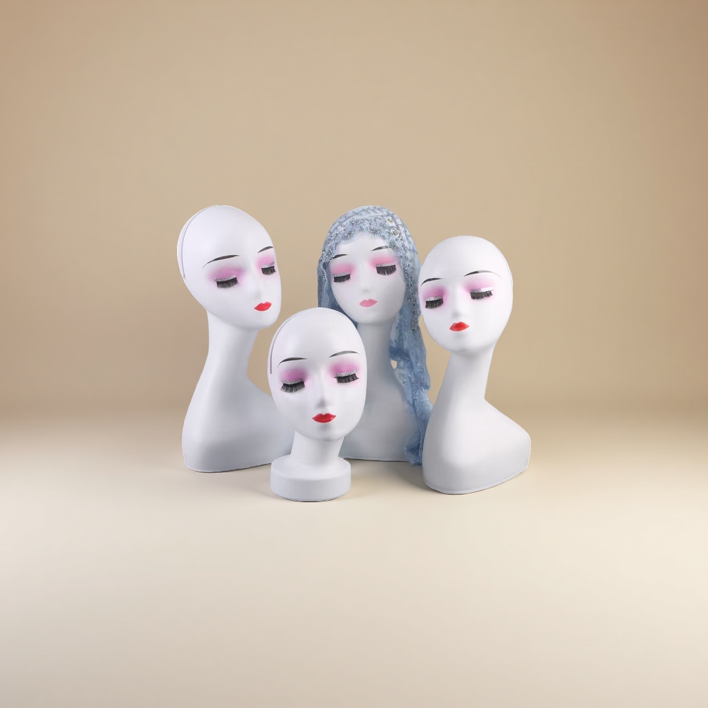 White human-shaped mannequin head, pink blush, red lips, blue lace veil