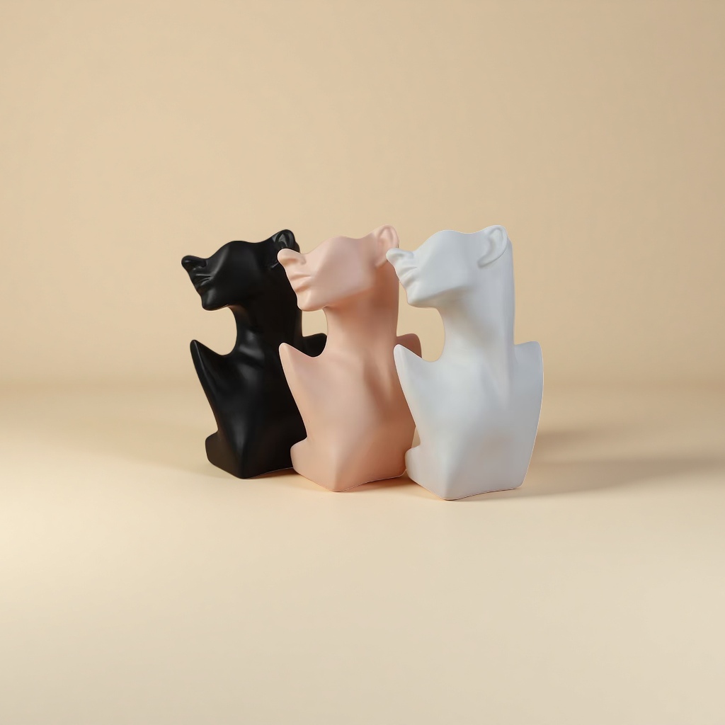 Three abstract sculptures of human heads and necks in black, white and white are arranged in combination Application Scenario