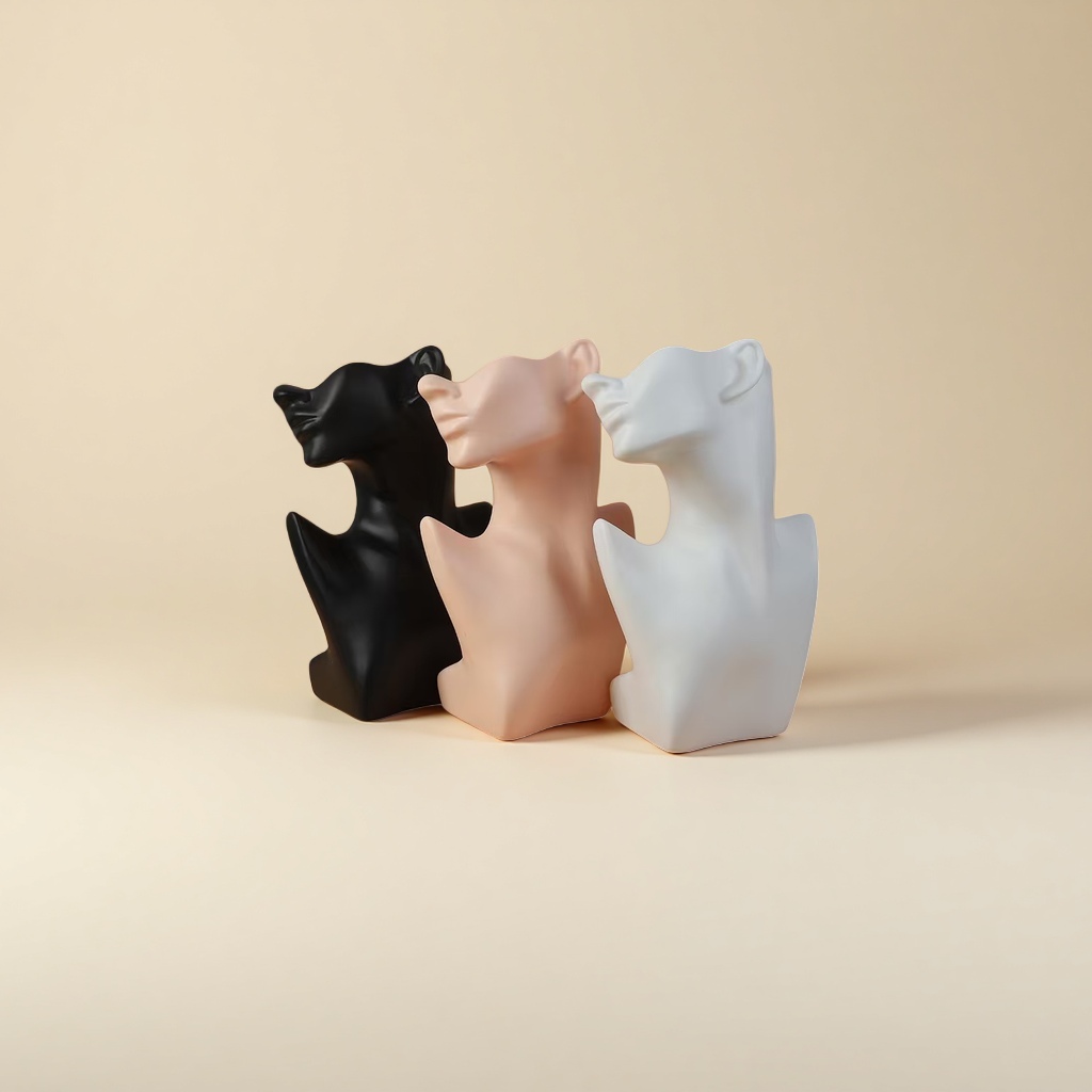Three abstract sculptures of human heads and necks in black, white and white are arranged in combination Specification image