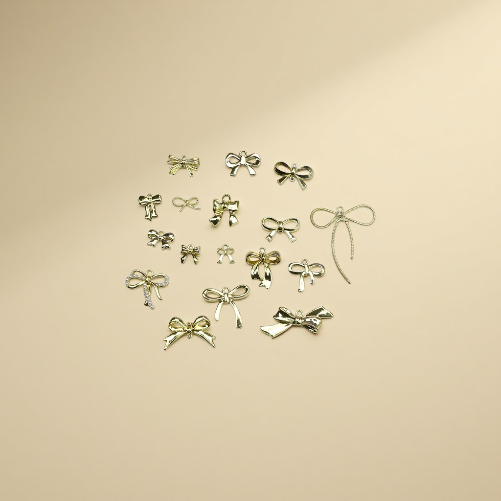 A collection of retro golden bow double and single through-hole pendants, DIY jewelry accessories, and handcrafted materials details Picture