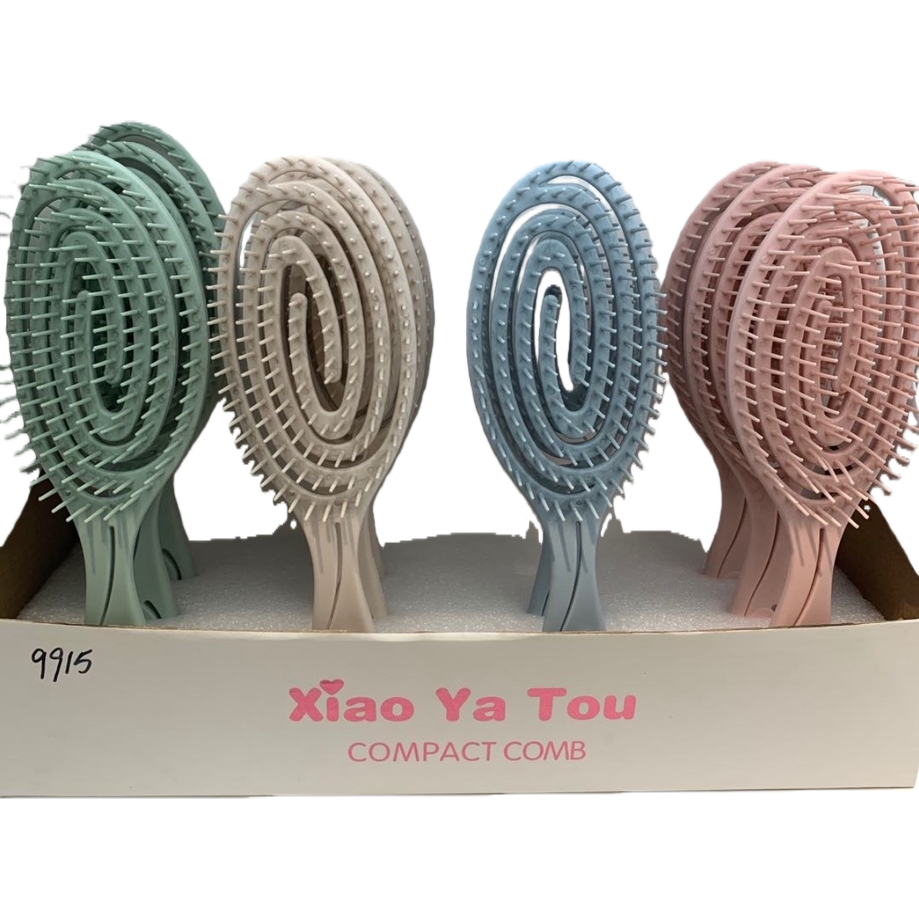 描述词：彩色螺旋梳子  
主体：Xiao Ya Tou 紧凑型梳子白底实物图