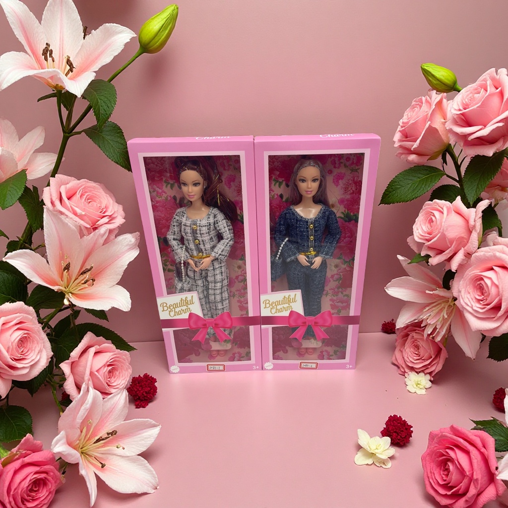 A pink gift box of two fashionable Barbie dolls with floral patterns and Beautiful Charm, decorated with a bow details Picture