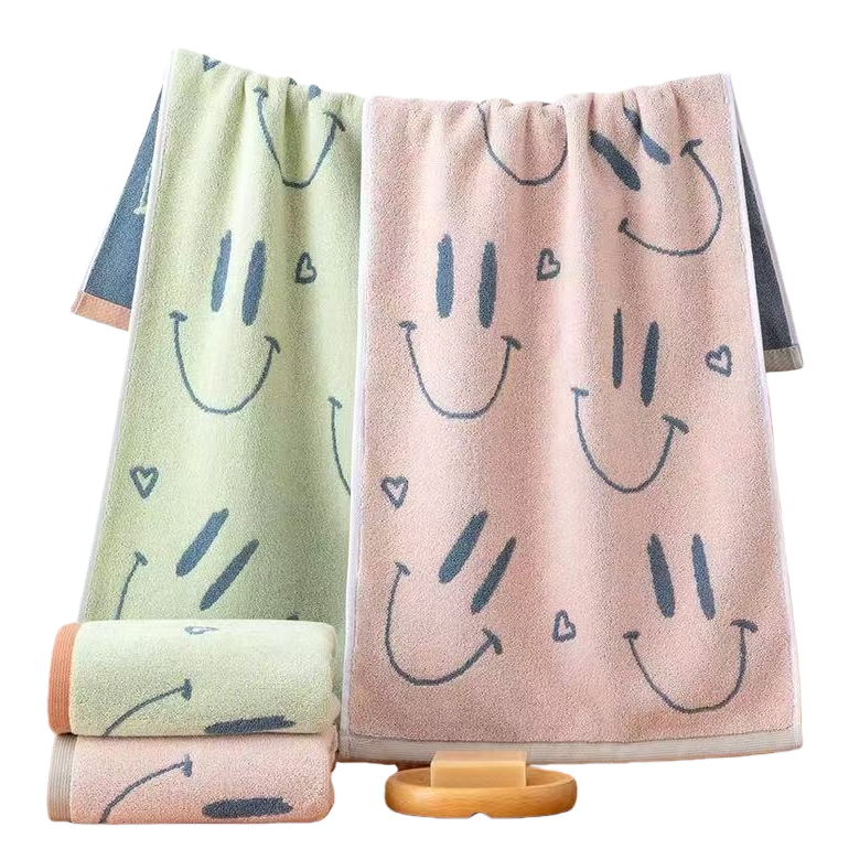 The smiling face pattern towel is soft and absorbent. The household bathroom towel is thickened and breathable Item Picture