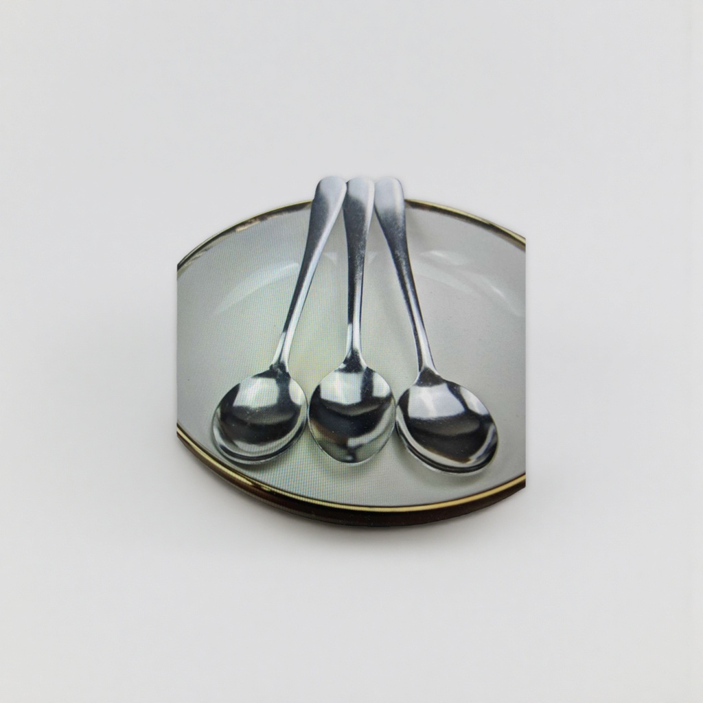 A set of three silver metal spoons with a white gold-edge tray Application Scenario