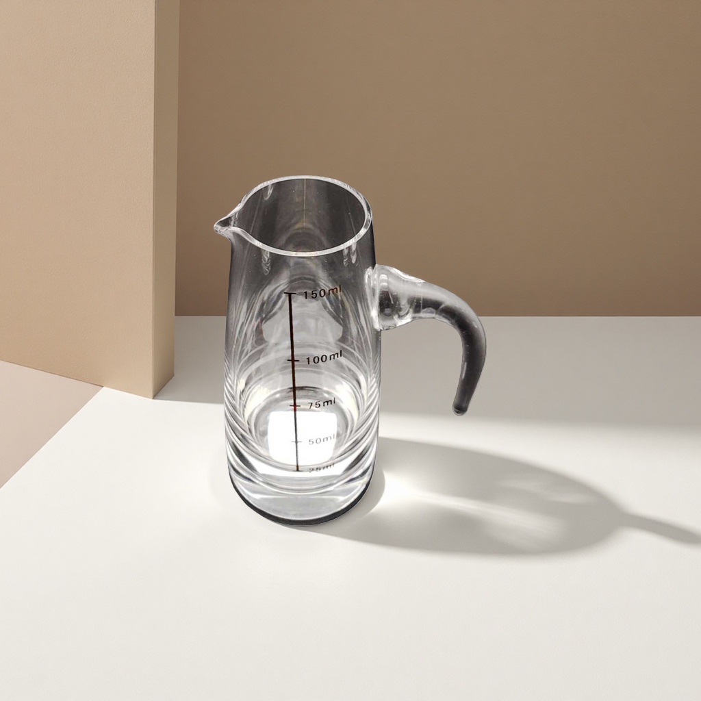 The main body of the transparent glass measuring cup has clear capacity scales and is made of heat-resistant high borosilicate material