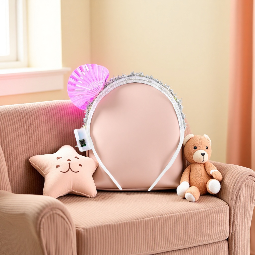The pink shell-decorated hairband is a sweet and girlish headwear with adjustable elastic hairband