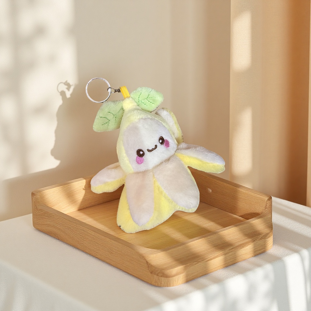 A cute and soft banana-shaped plush toy pendant for home decoration, a car keychain