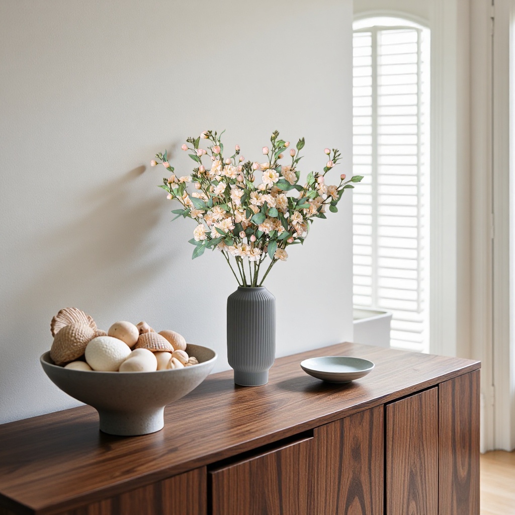 A home flower arrangement set with a simple glass vase and a bouquet
