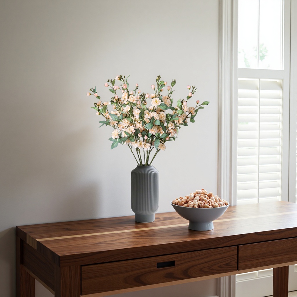 A home flower arrangement set with a simple glass vase and a bouquet details Picture