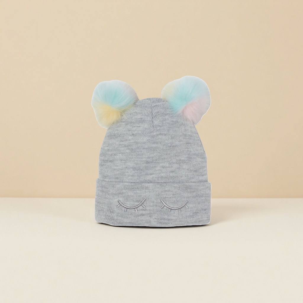 A grey woolen cap with colorful pom-poms and closed-eye embroidery, a warm winter knitted cap Application Scenario