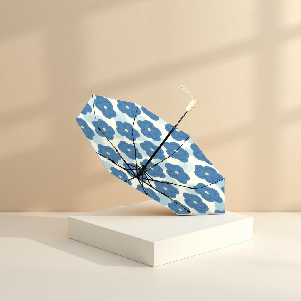 A blue flower-patterned umbrella for both weather and rain, waterproof, sun-proof, lightweight and foldable for ladies Application Scenario