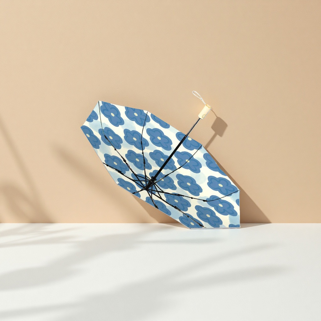 A blue flower-patterned umbrella for both weather and rain, waterproof, sun-proof, lightweight and foldable for ladies