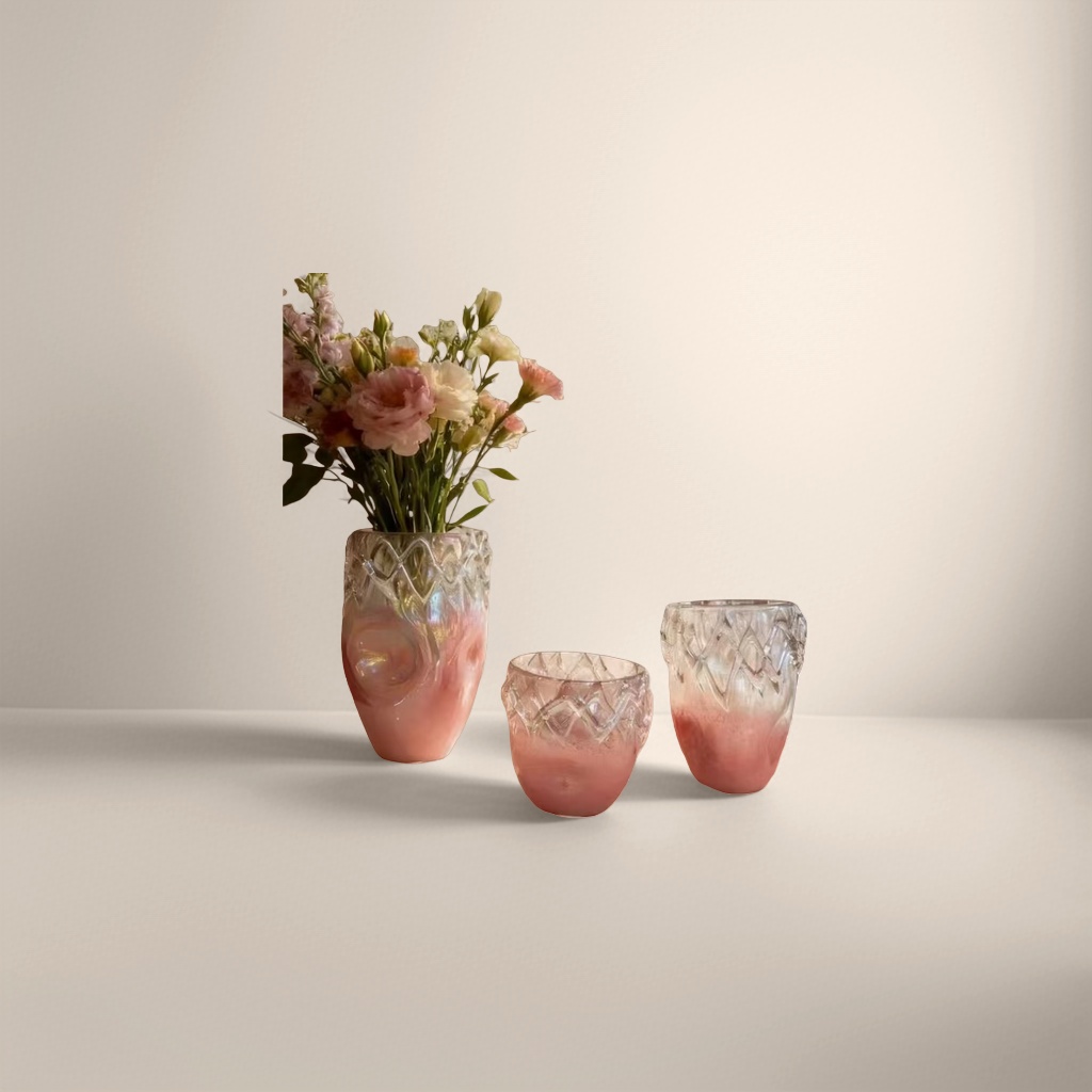 A set of pink gradient glass vases and glass cups for home decoration
