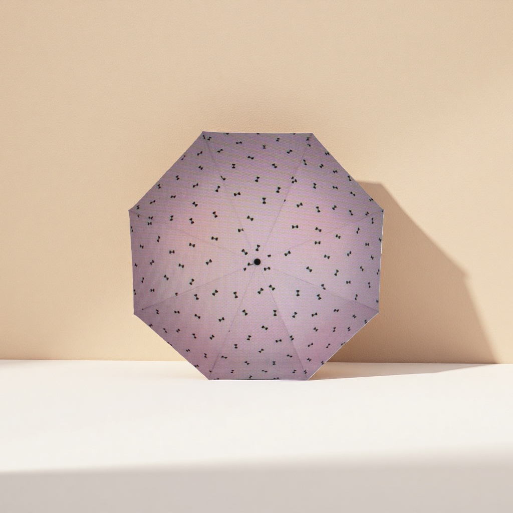 This pink umbrella with a black bow pattern is fashionable and rainproof, suitable for both sunny and rainy days, and can be easily folded Specification image