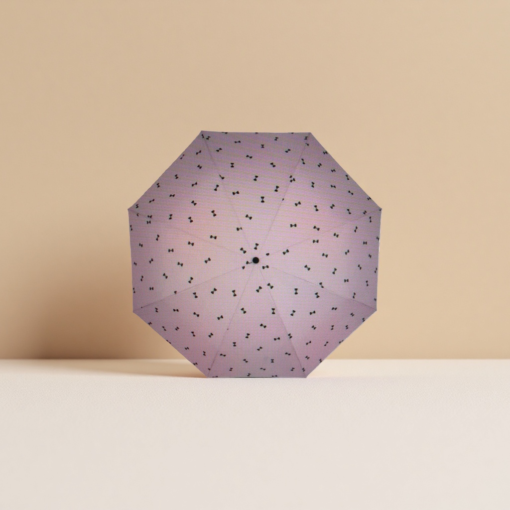 This pink umbrella with a black bow pattern is fashionable and rainproof, suitable for both sunny and rainy days, and can be easily folded Application Scenario