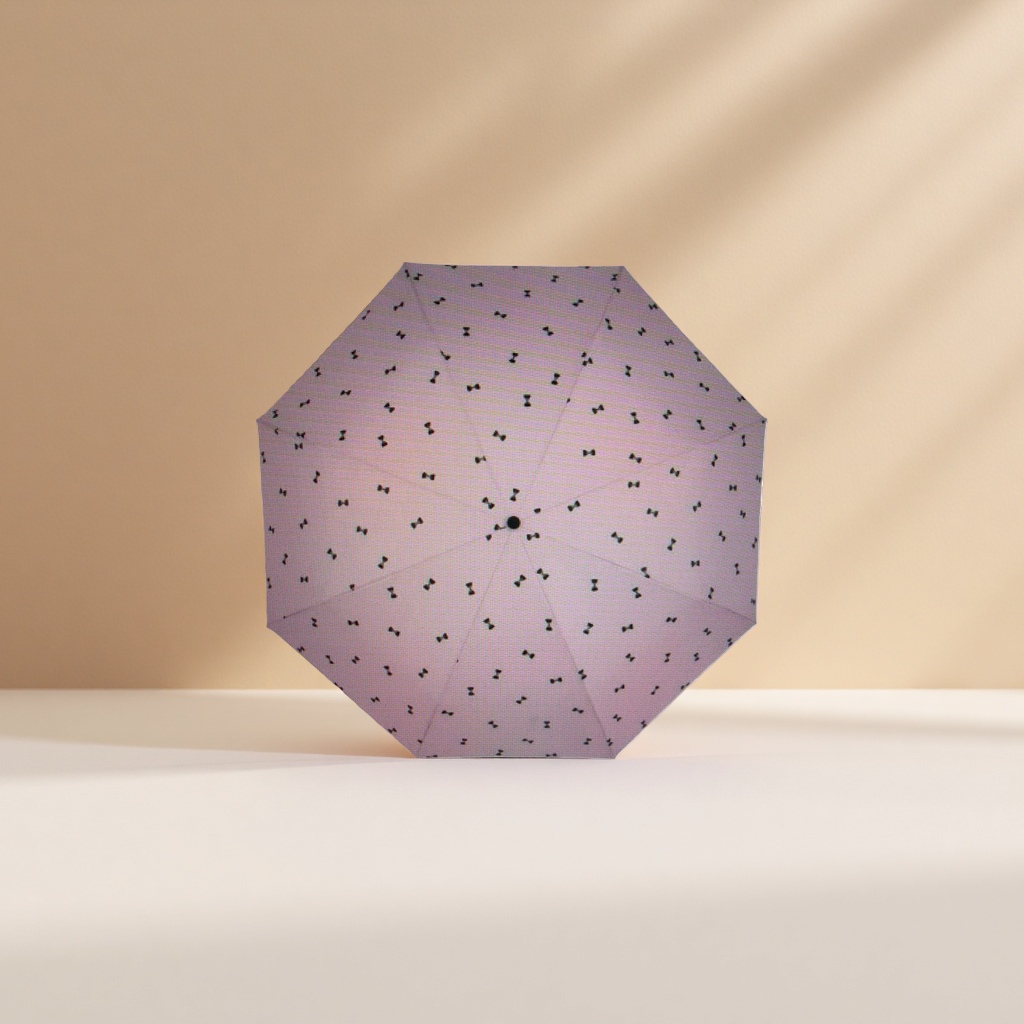 This pink umbrella with a black bow pattern is fashionable and rainproof, suitable for both sunny and rainy days, and can be easily folded details Picture