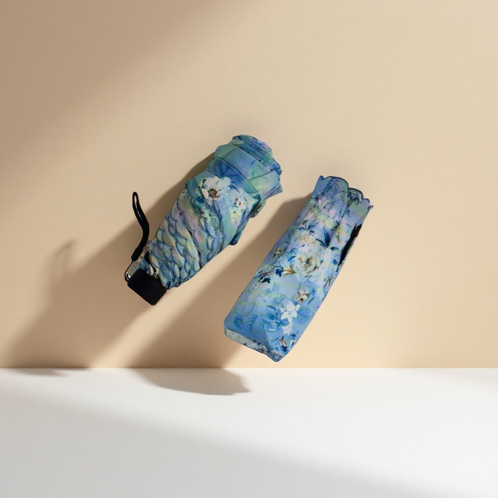 The blue floral pattern folding umbrella is waterproof, sun-proof, portable and suitable for ladies in both sunny and rainy weather Application Scenario