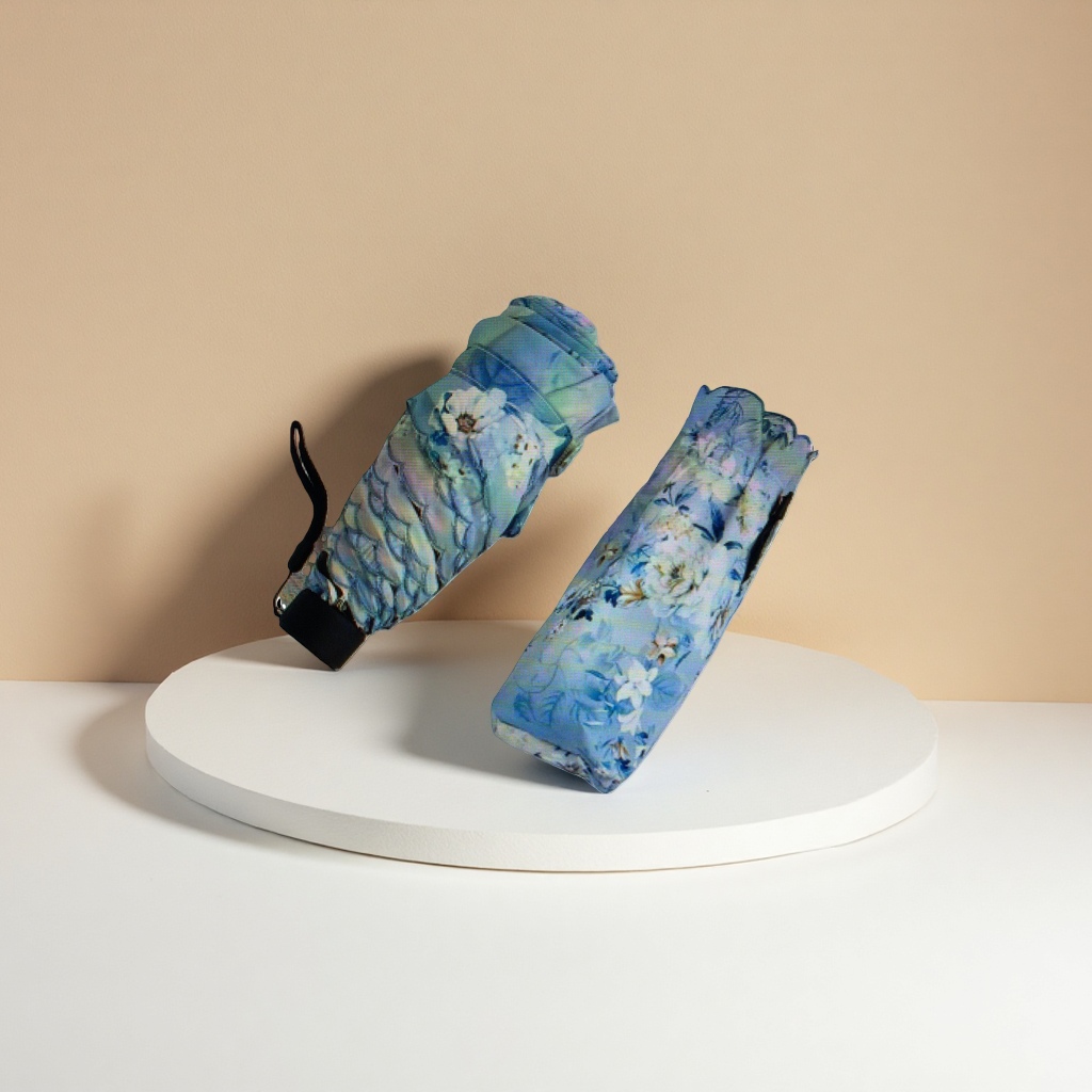 The blue floral pattern folding umbrella is waterproof, sun-proof, portable and suitable for ladies in both sunny and rainy weather
