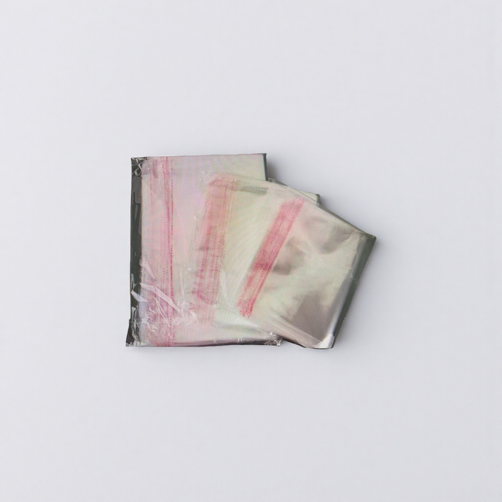 An eco-friendly handbag with a transparent plastic bag and red striped paper packaging details Picture