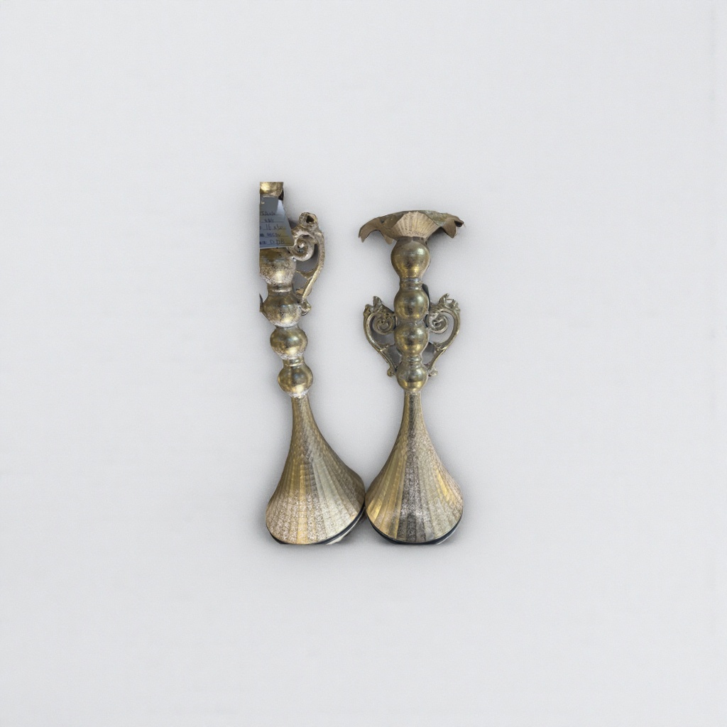 A decorative metal candlestick with a golden retro-style living room tabletop