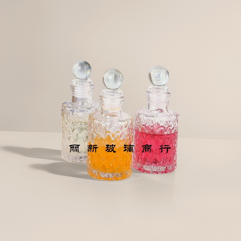 Three transparent glass bottles containing colored liquid, round glass balls, with caps and a background of a book photo frame