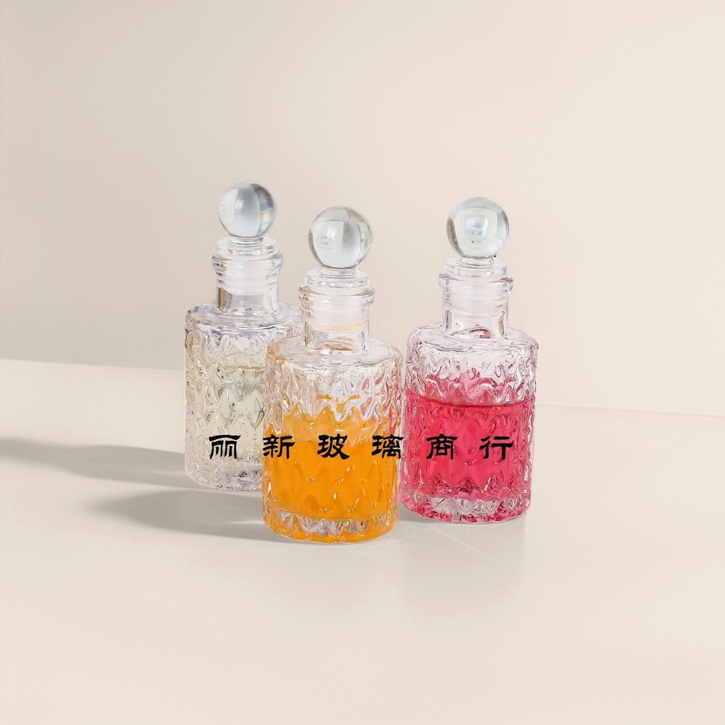 Three transparent glass bottles containing colored liquid, round glass balls, with caps and a background of a book photo frame Application Scenario