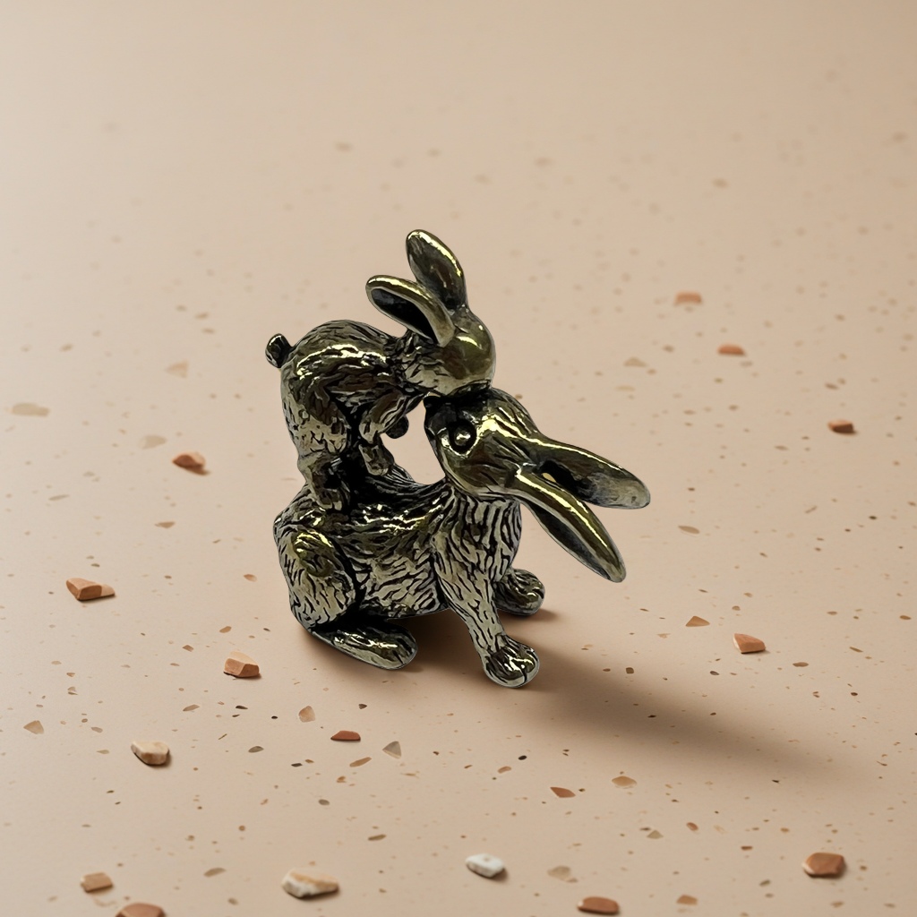 A creative home decoration piece featuring a combination of brass decorative sculptures of kissing rabbits Application Scenario