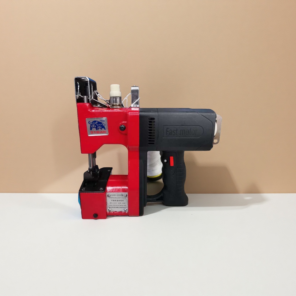 The main body of the red handheld sewing machine is a portable industrial sewing device