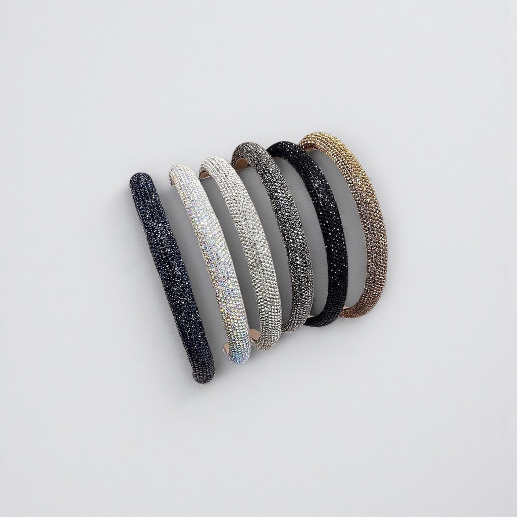 A dazzling diamond-encrusted hairband in five colors: deep blue, silver, black, gold and white. Books are displayed details Picture
