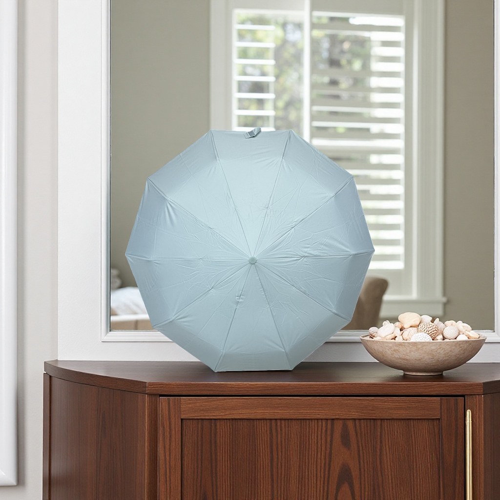 This portable folding umbrella is lightweight, windproof, sun-proof, and suitable for both sunny and rainy days. It can be opened and closed with one button