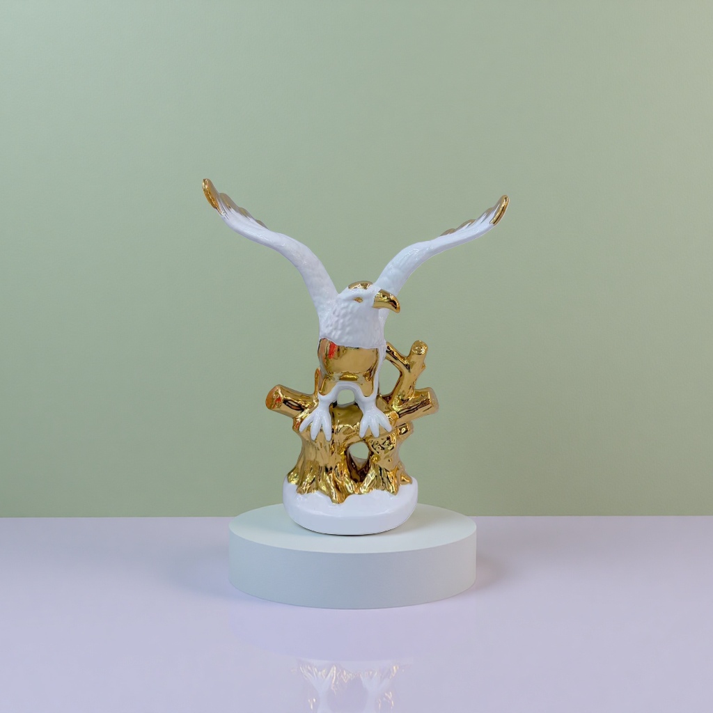 A white and gold eagle sculpture decoration for the living room and office details Picture