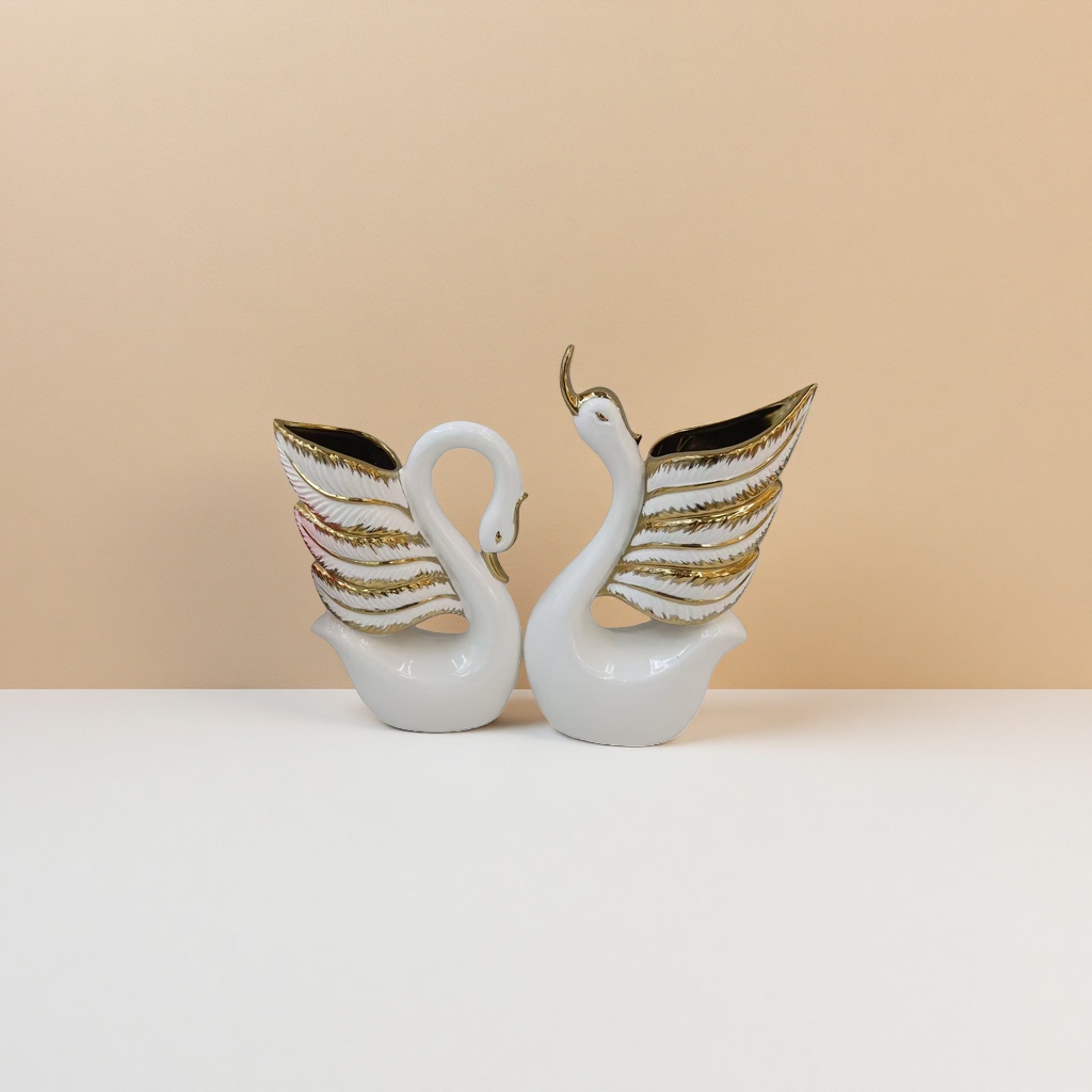 A white ceramic swan-shaped vase for home living room decoration Application Scenario
