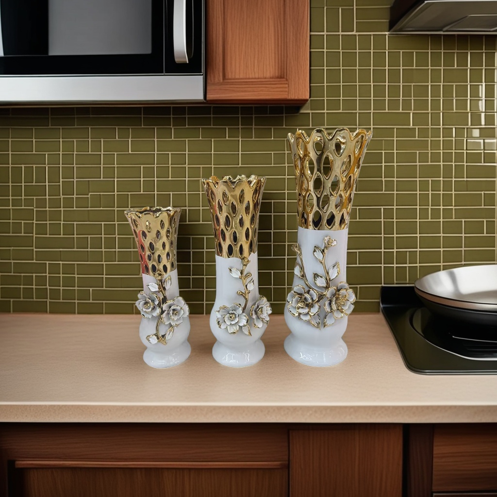 Three white base and golden hollowed-out top decorative vases details Picture