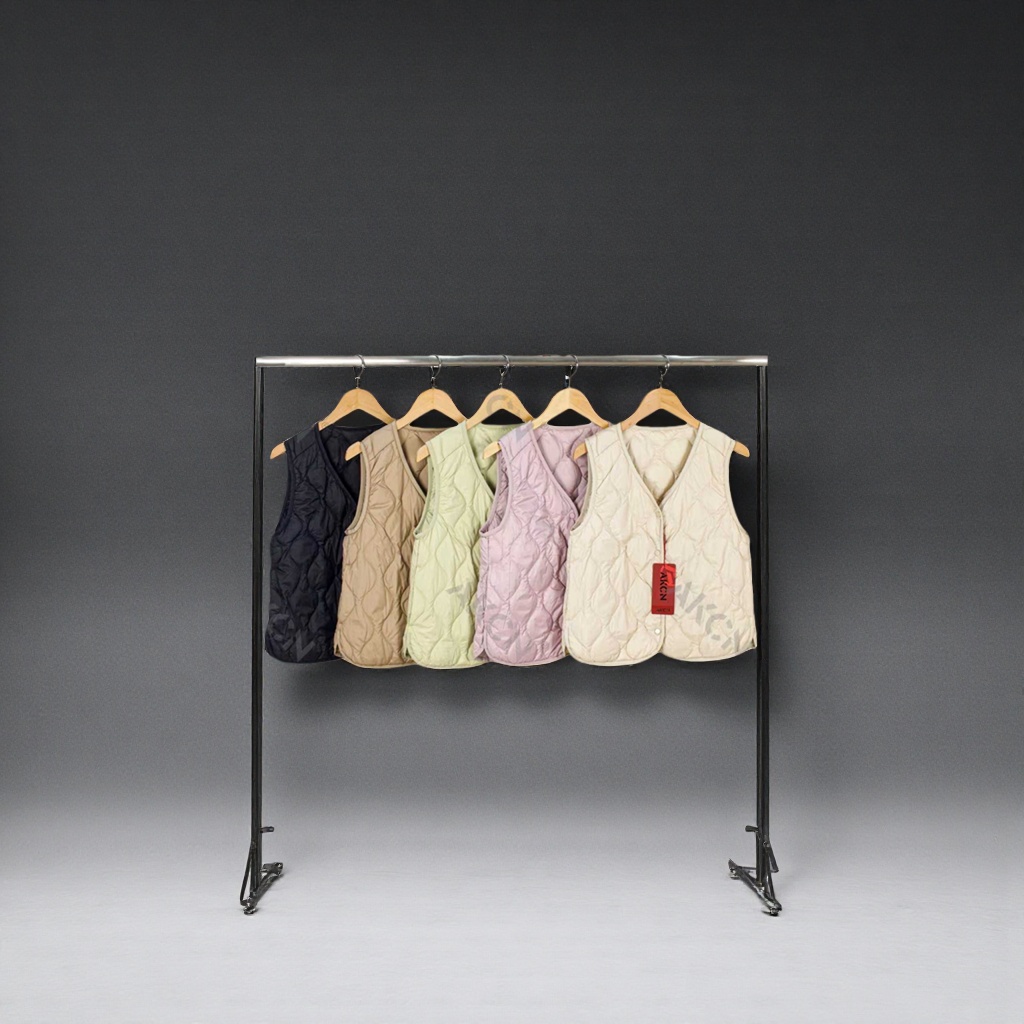 Description words: Multi-color quilted vest Main body: Five quilted sleeveless vests of different colors, hung on a hanger for display. The colors include black, khaki, light green, light pink and off-white Specification image