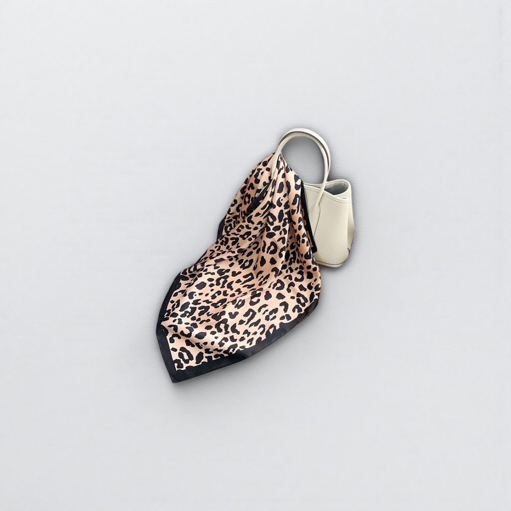 A leopard print pattern silk scarf is a fashionable and versatile silk blend scarf for women in spring and summer
