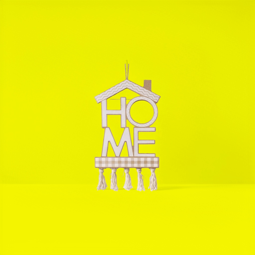 The house is shaped like a HOME with wavy roof, checkered bottom and tassel decoration details Picture