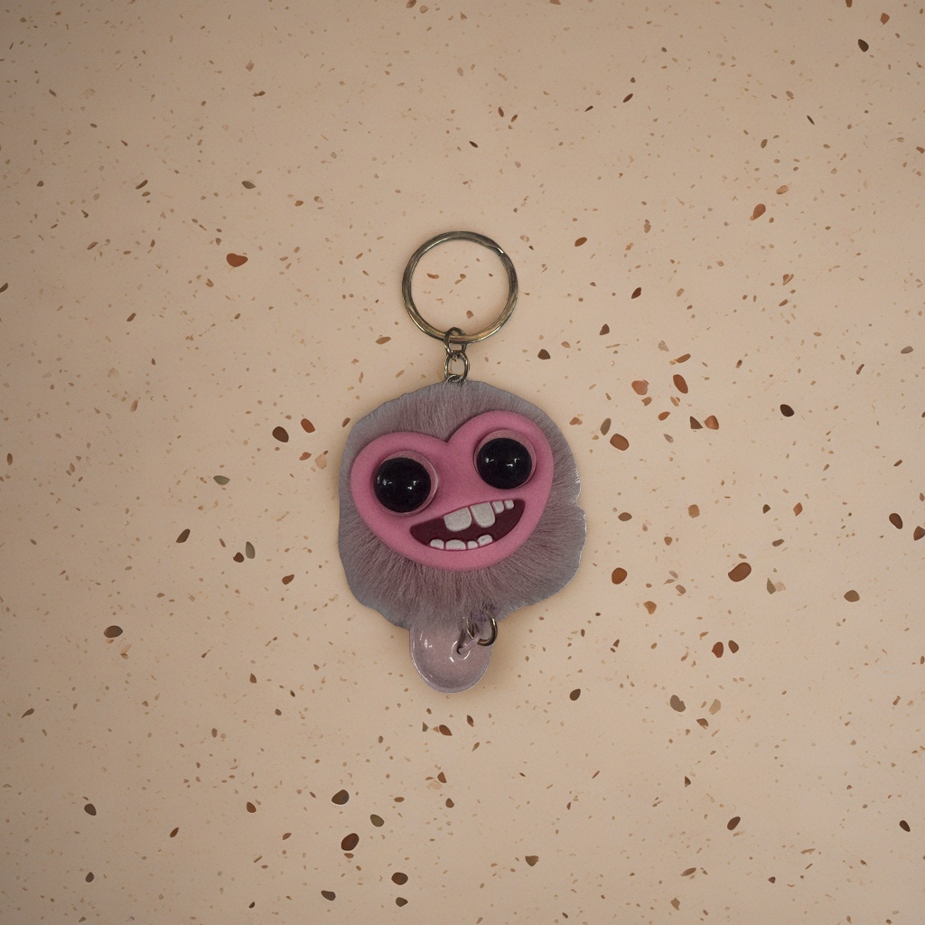 The pink plush keychain is a cute and soft pendant as a gift decoration details Picture