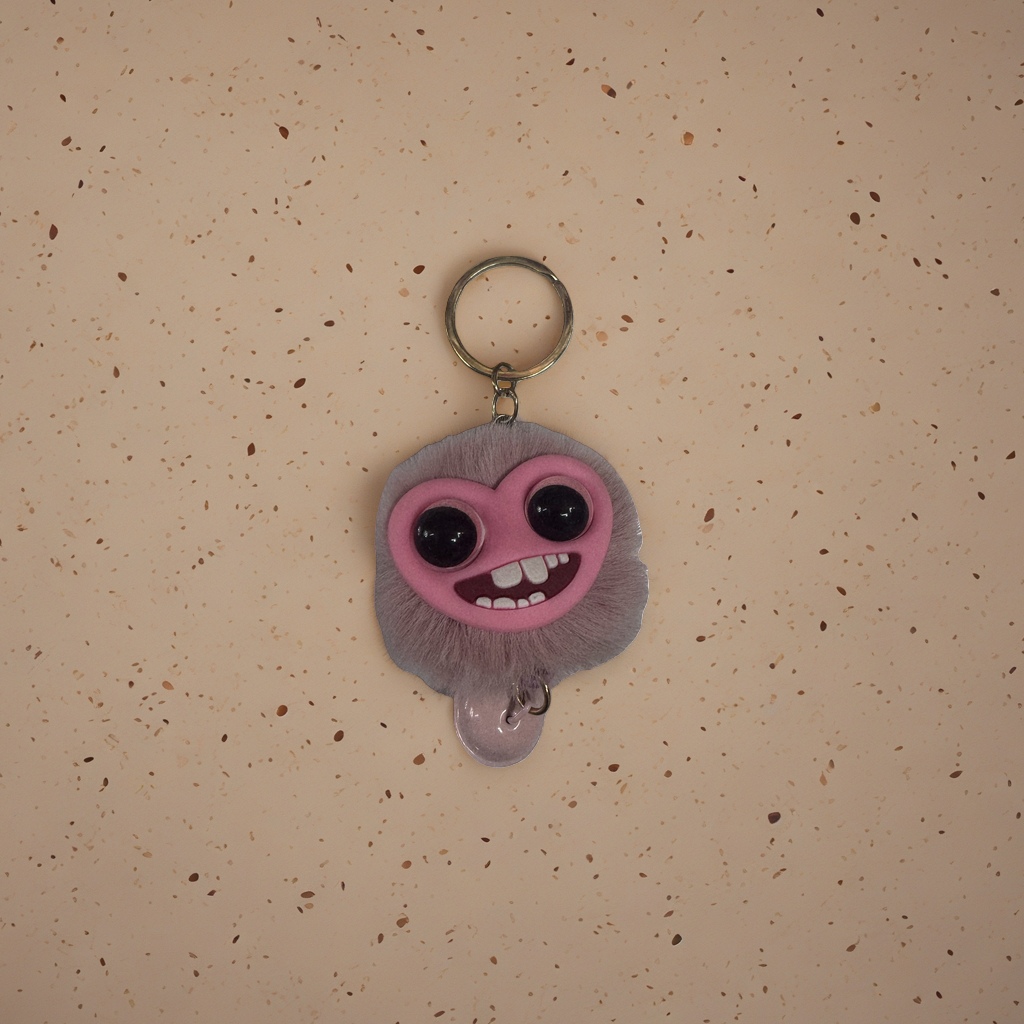 The pink plush keychain is a cute and soft pendant as a gift decoration