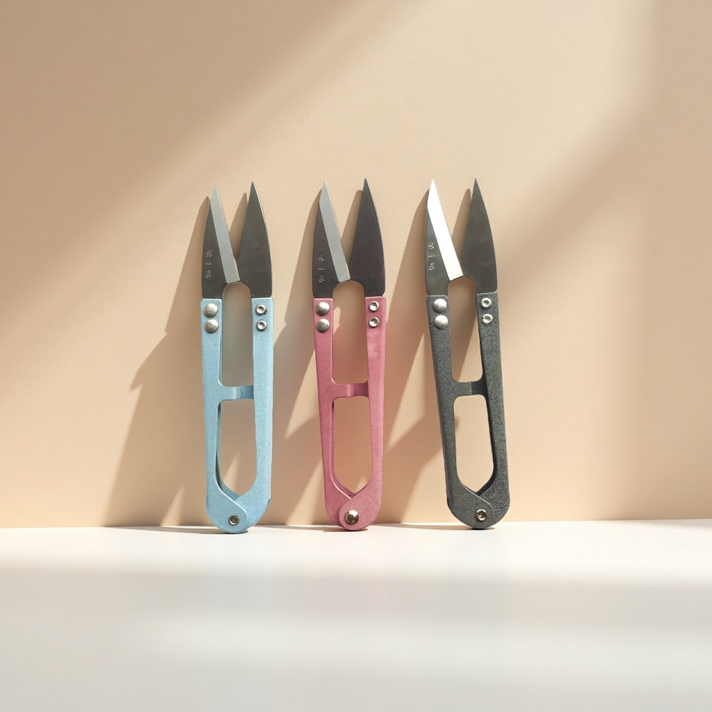 Three sets of colored scissors, blue, pink and grey household cutting tools details Picture