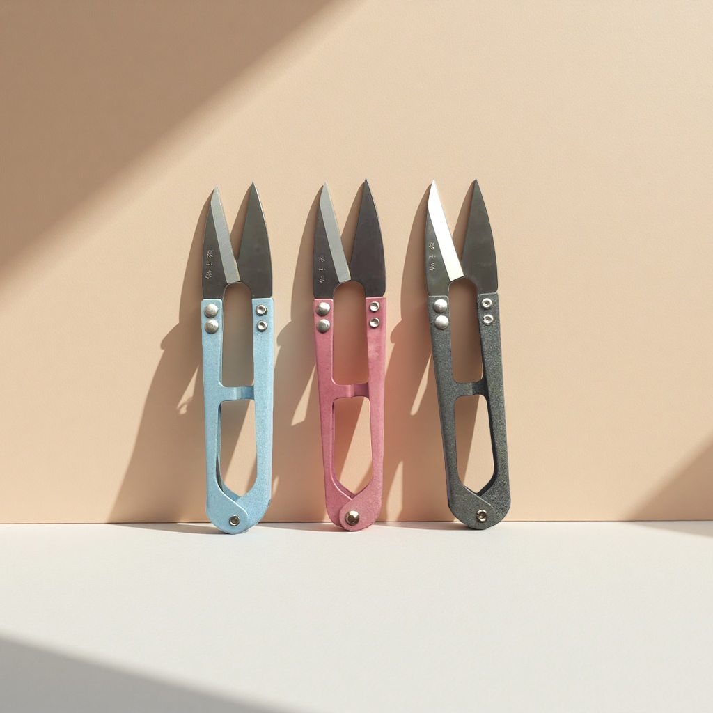 Three sets of colored scissors, blue, pink and grey household cutting tools Application Scenario