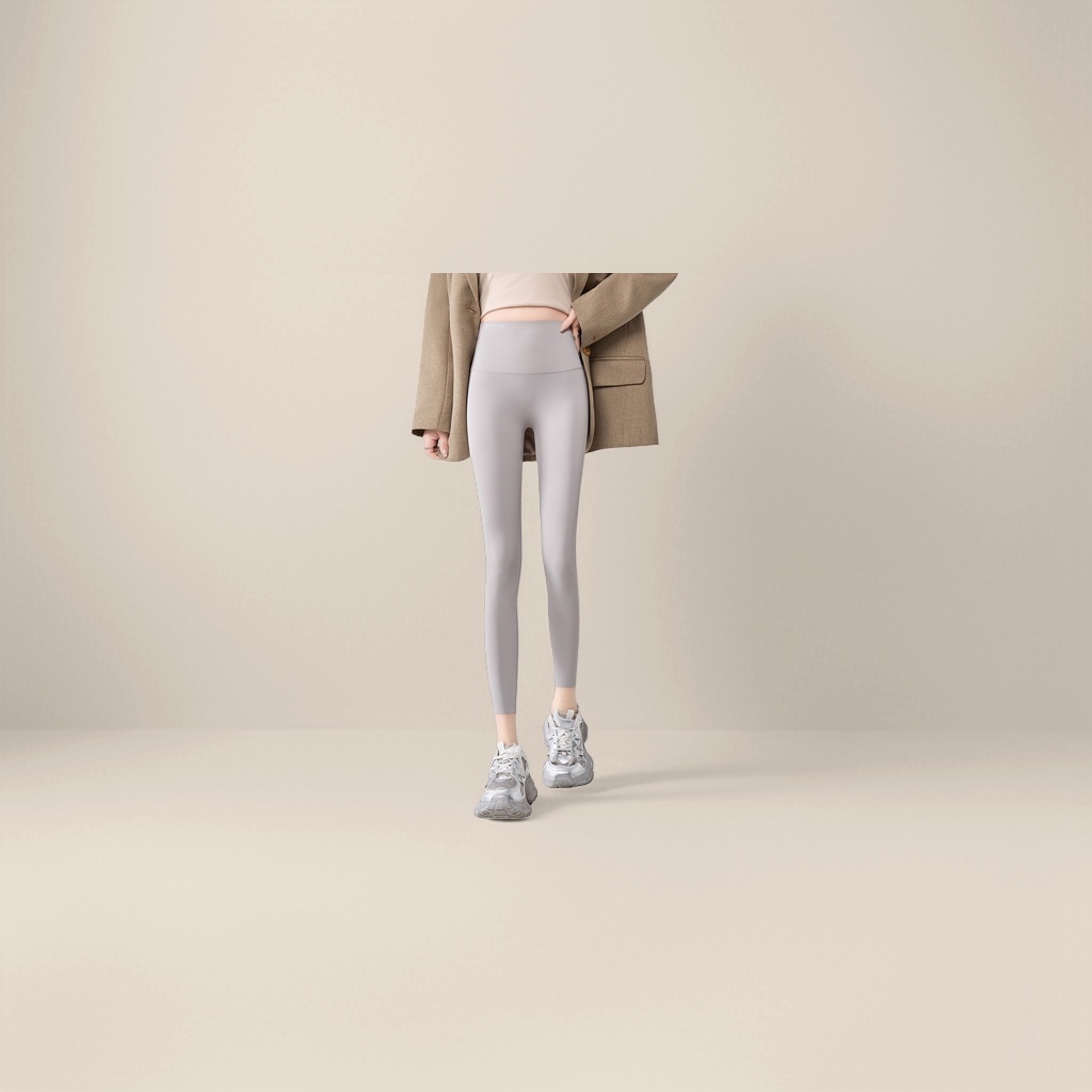 High-waisted, belt-cinching light grey skinny pants for women, elastic and form-fitting leggings
