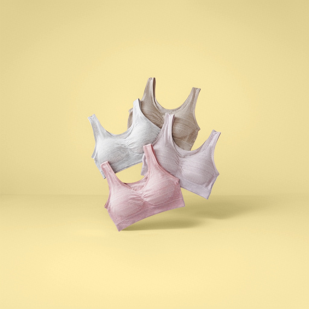 The light grey, beige, light pink and light pink bras without underwire are laid flat to show the comfort of light-colored bras for women in summer Application Scenario