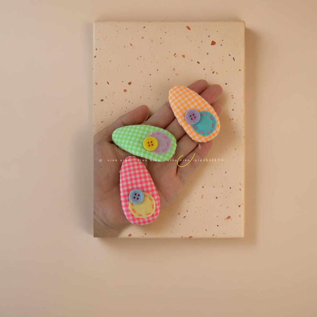A pair of cute handcrafted fabric hair clips and bow hair accessories for girls