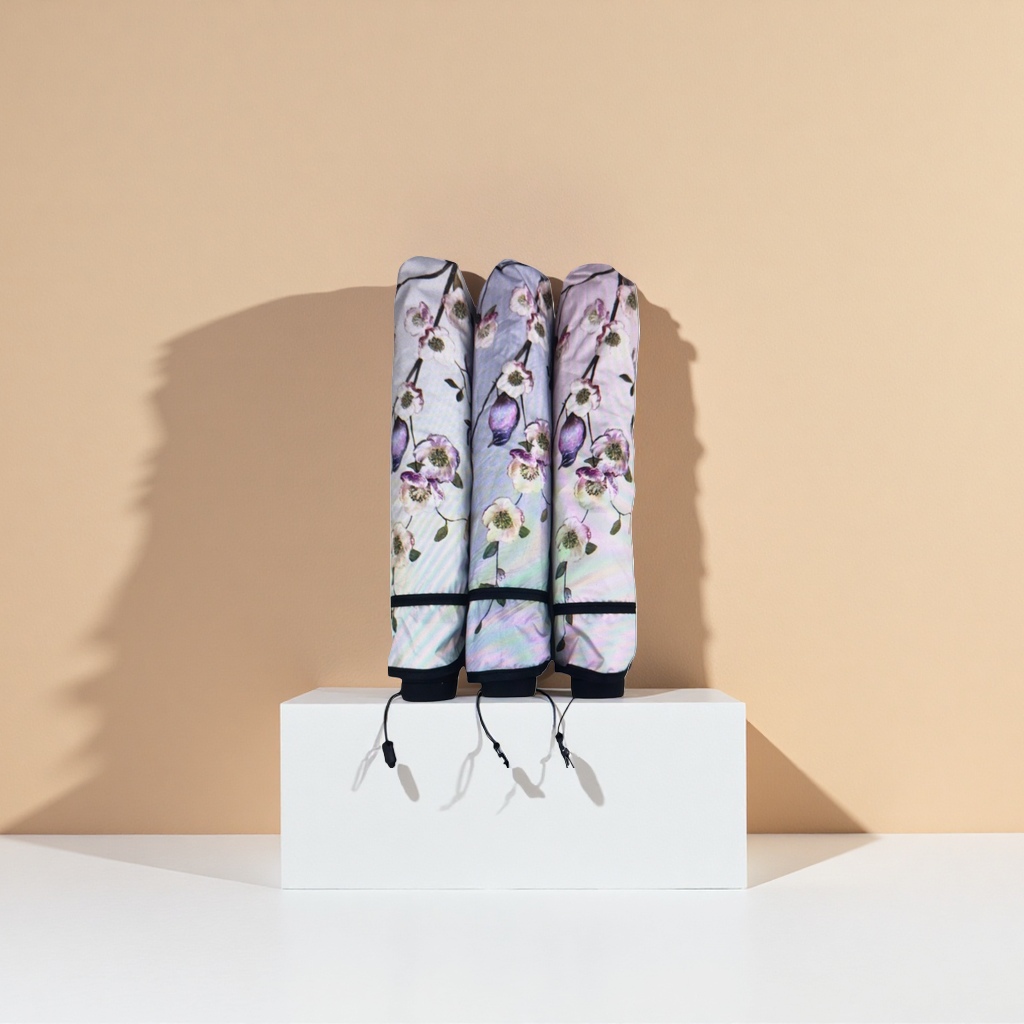 A portable, automatic opening and closing umbrella made of high-density impact-patterned fabric for women Application Scenario